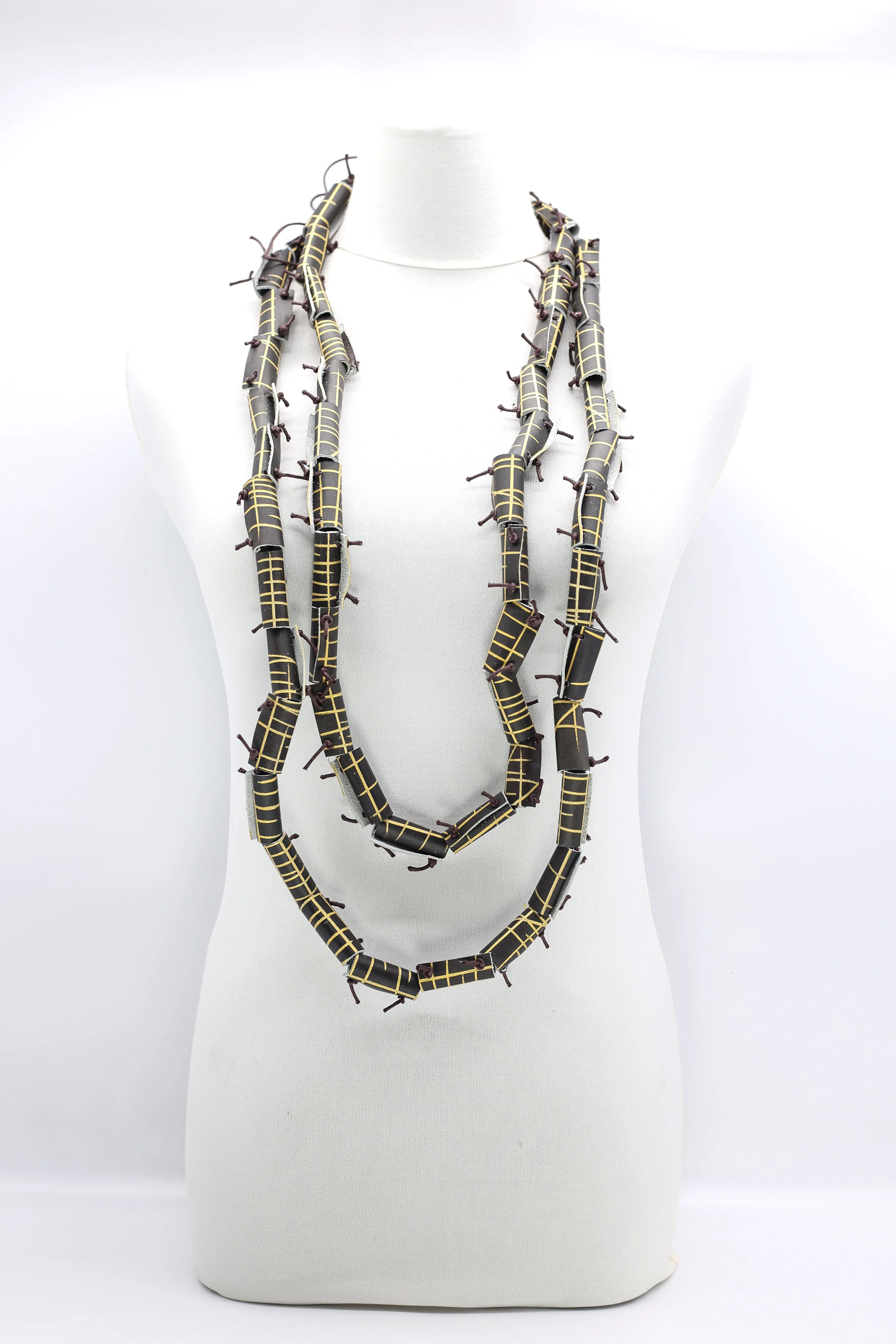 220cm-long hand carved and painted recycled leather necklace